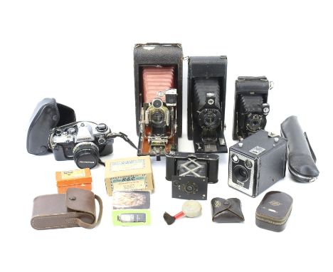 An assortment of vintage cameras and accessories. Comprising a UN Japanese blow brush, a two part Sangamo Weston Master V uni