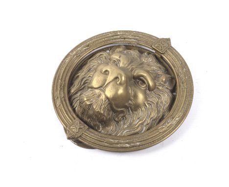 A vintage brass door knocker modelled as a lion's face within a wreath. Diameter 23cm