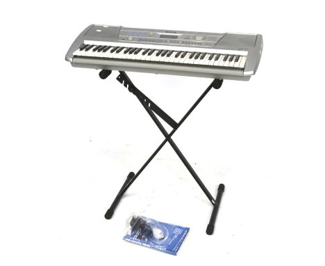 A Yamaha electronic piano keyboard and stand. PSR-290. Comes with Owner's manual and power supply KPA3. 