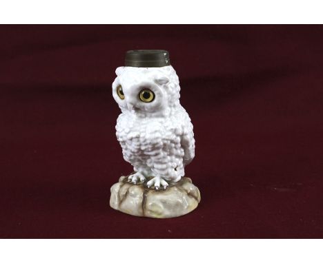 A vintage German ceramic lamp base modelled as a snowy owl. With glass eyes, blue crossed swords mark to base, H16cm