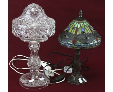 Two 20th century table lamps. Comprising a Tiffany style lamp with a leaded glass shade, H37cm and a moulded glass lamp, H38c