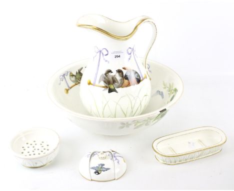 A Minton wash set. Comprising a pitcher, bowl and two dishes, all decorated with birds, H30cm Condition Report: The lid of th