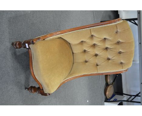 Victorian walnut framed nursing chair, light golden upholstery, with turned and ringed supports, width 55cm.