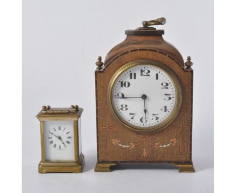 Edwardian stained wood and inlaid bracket clock, 22cm, and a carriage clock.