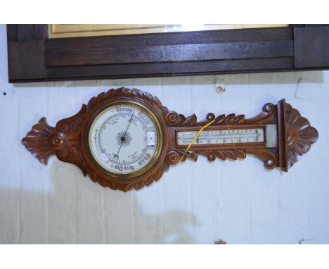 Carved oak cased barometer, with thermometer, 87cm.