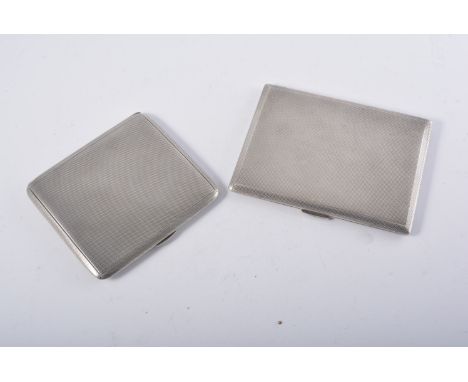 Silver cigarette case, London 1962, engine turned, engraved inscription, 11cm and another cigarette case, (2).