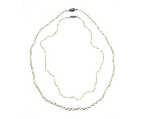 A cultured pearl necklace, the ninety-nine graduated pearls measuring 4.5 to 7.7mm diameter, with 9ct white gold clasp set wi