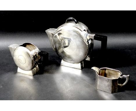 An Art Deco silver plated two piece tea set, comprising teapot, 16.5cm high, and milk jug, 10cm high, together with a silver 