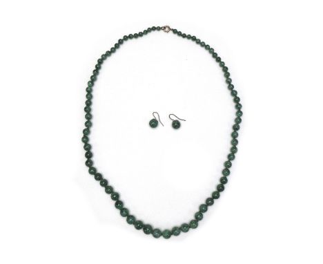 A vintage jade bead necklace, of seventy eight graduated beads, 57cm long, 40.8g, with twenty five further beads loose, and a