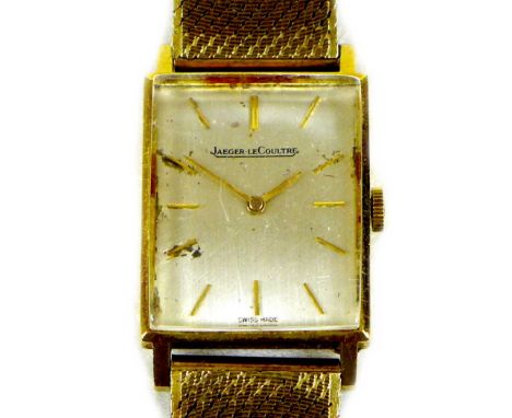 A Jaeger LeCoultre 18ct gold cased gentleman?s wristwatch, circa 1966, the rectangular brushed silvered dial with gold batons