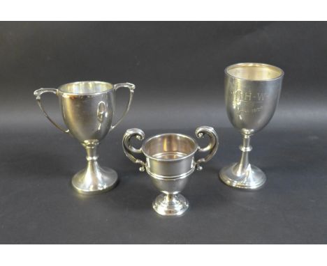 Three silver cups, comprising a George V Christening goblet, inscribed 'J.H.W. 24 Jan 1929', William Neale, Birmingham 1925, 