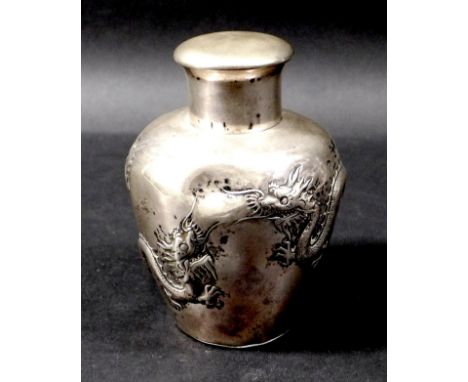 A Chinese silver tea caddy, by Luen Wo, Shanghai, circa 1880, of ovoid form repousse decorated with two facing four clawed dr