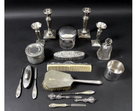 A collection of silver dressing table items, including a cylindrical glass dressing table pot, the silver lid monogram engrav