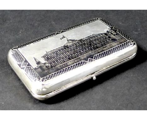 A Russian silver cigar case, circa 1880s,&nbsp;maker 'НФ', NF in Cyrillic, engraved and niello decorated with a view of the G