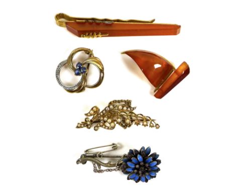 A group of mostly 20th century brooches, to include a 15ct gold and seed pearl brooch in the form of lily of the Valley, with