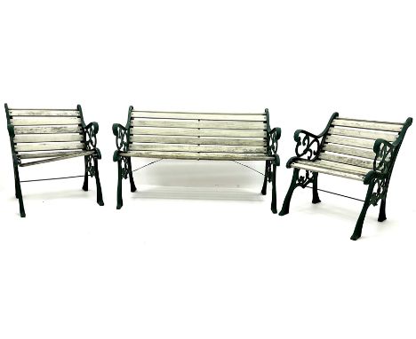 Cast iron garden bench, painted timber slats (W127cm) and pair of matching armchairs (W63cm)