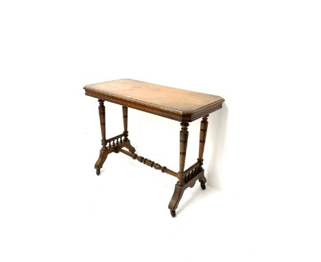 Late Victorian oak side table, moulded top, bobbin turned supports and stretcher, shaped feet and castorsDimensions: Height:&