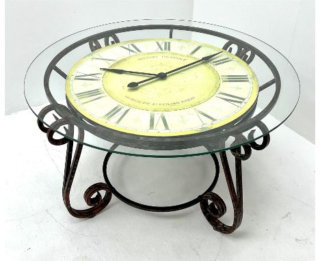 Contemporary circular garden table, circular glass top over Quartz powered clock, on s-scroll wrought metal baseDimensions: H