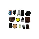 Assorted vintage camera accessories.