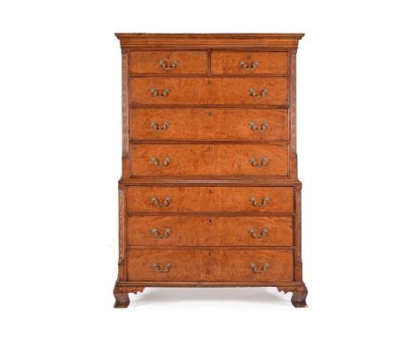 A George III pollard oak chest on chest, circa 1780, the moulded cornice incorporating a chequer banded frieze, above two sho