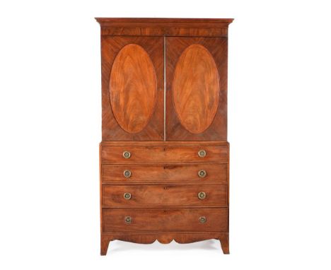 A Regency mahogany and inlaid linen press, circa 1815, probably Channel Islands, the cavetto moulded cornice, above a pair of