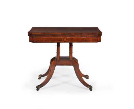 ϒ A Regency rosewood card table, circa 1815, the hinged and mahogany crossbanded top opening and rotating to a baize inset pl