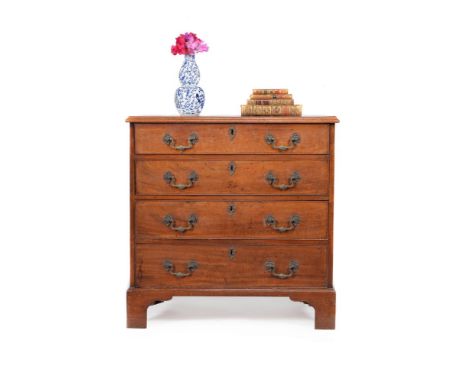 A George III mahogany chest of drawers, circa 1780, the rectangular top with moulded edge, above four long graduated drawers,