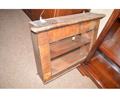 A Victorian mahogany hanging cabinet, the glazed front with reeded design above and below, the mirror-back interior fitted a 