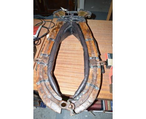 A vintage leather horse collar.