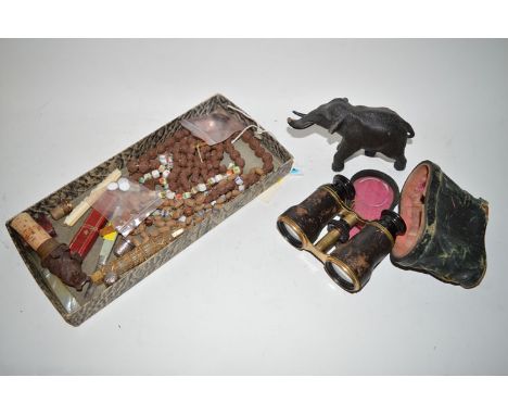 A box of collectables, including: a bronze elephant; a pair of binoculars; a carved wood bear stopper; two mother-of-pearl fr