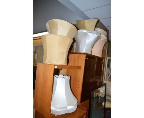 Eight standard lamp shades.