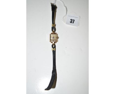 A 9ct. gold cased Tudor cocktail watch, in Art Deco style case, with baton and arabic numerals, on leather strap.