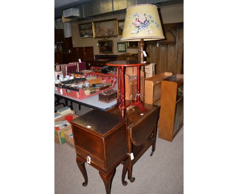 A stained wood bedside cabinet; an occasional table; an oak trolley; a wall mounted cabinet; and a standard lamp. (5)
