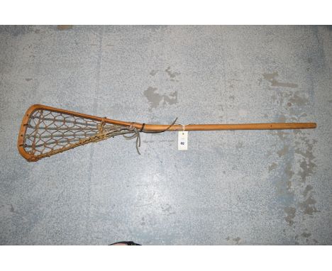 An early 20th Century lacrosse stick in hickory, inscribed T. S. Hattersley's, Viktoria, Made In England.