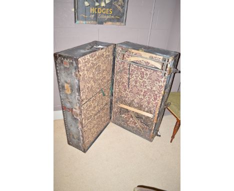 A late 19th/early 20th Century metal bound 'Neverbreak' dressing treble trunk, opening to reveal five graduated drawers and h