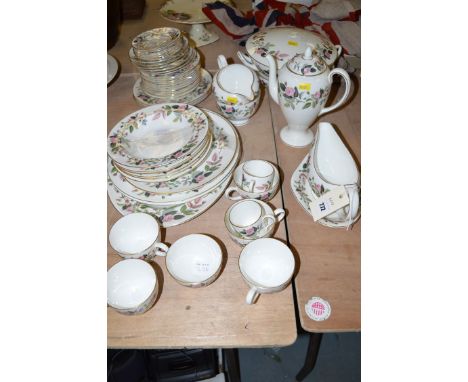 A Wedgwood 'Hathaway Rose' pattern part tea and dinner service, comprising: tureen (missing cover handle) deep plates, saucer