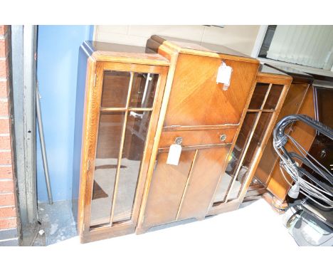 A mid 20th Century stained wood bureau cabinet, the fall flap enclosing fitted interior above single drawer and cupboard door