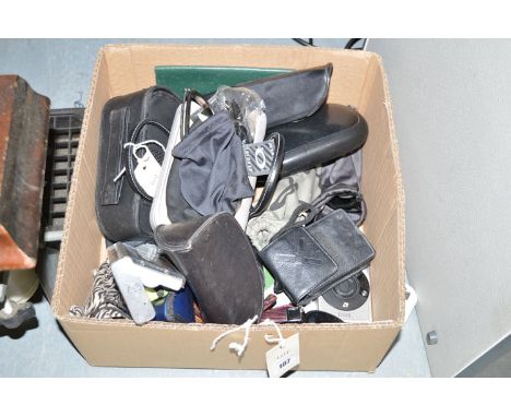 A small quantity of sunglasses; a Swatch Watch; and two Canon Compact cameras, in a box.