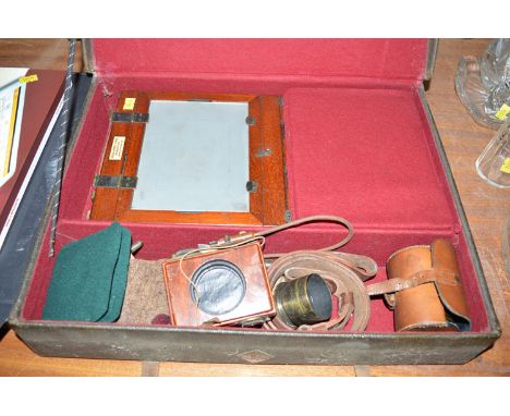 A Victorian mahogany and brass half plate camera, bearing a label inscribed Spears & Ponds Stores Photographing Department, Q