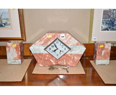 An Art Deco rose and white veined marble mantel clock, the diamond-shaped dial with arabic numerals, named George Robergeon, 