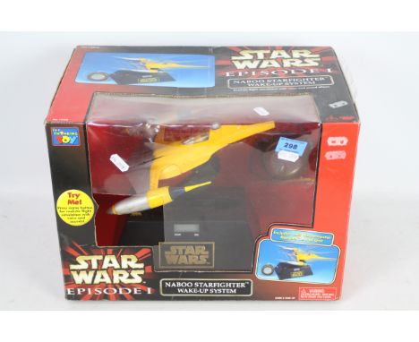 Star Wars - Episode 1 - Naboo Starfighter Wake-Up System - Includes Jedi Holoprojector Remote Control Unit. Item appears in b