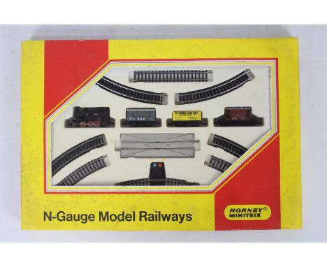 Hornby Minitrix - A boxed N Gauge Goods Set # No.101 with an 0-6-0 tank engine, 3 x wagons and track. The items appear Near M