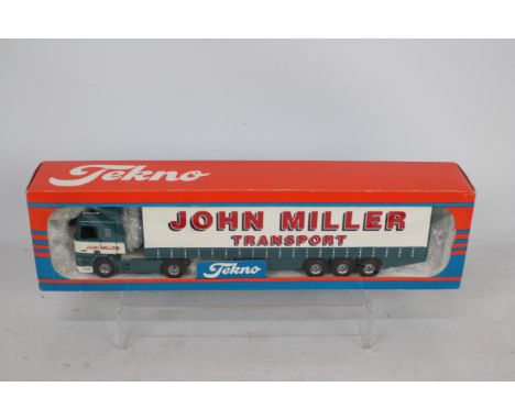 Tekno - A boxed Leyland DAF 95 Curtainsider in John Miller Transport livery in 1:50 scale. The model appears in Mint conditio