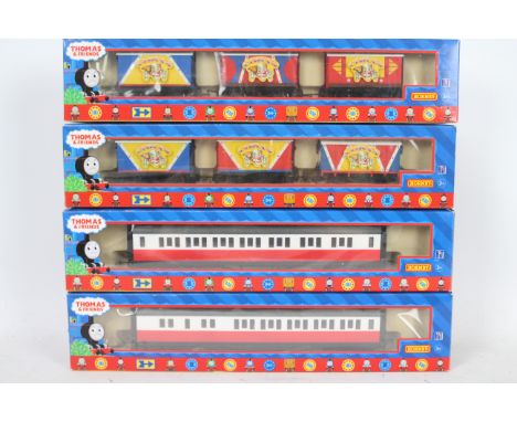 Hornby - Four boxed Hornby OO gauge 'Thomas the Tank Engine &amp; Friends' items of 'Circus' rolling stock. Lot consists of R