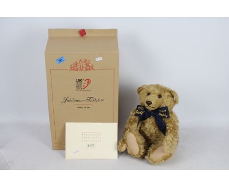 Steiff Teddy Bear - A boxed Steiff Blonde Curly Mohair bear with friendship bracelet 'Centenary Teddy Bear' #670985 Bear meas