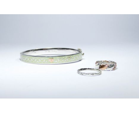 A Clogau silver bangle marked .925 and two silver Clogau rings both marked .925