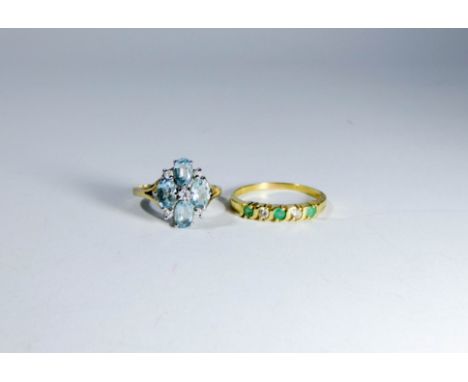 A 9ct gold blue topaz dress ring and an 18ct gold emerald and diamond half hoop ring size S and O 