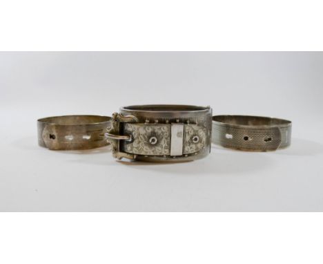 Large Victorian buckle design bangle an two silver adjustable bangles 