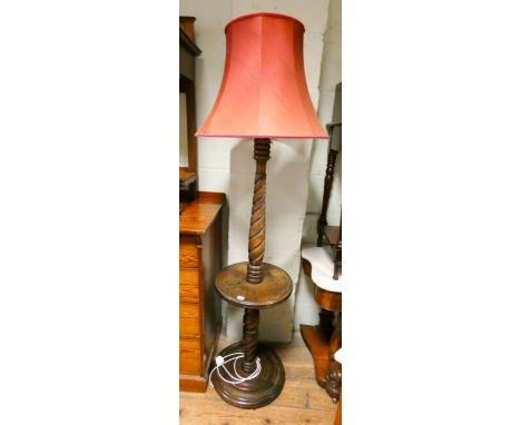 An oak barley twist standard lamp fitted centre table with red shade 