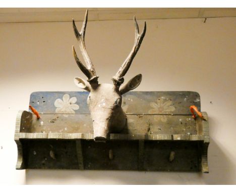 An old Victorian carved wood shelf mounted with a wooden deer head 